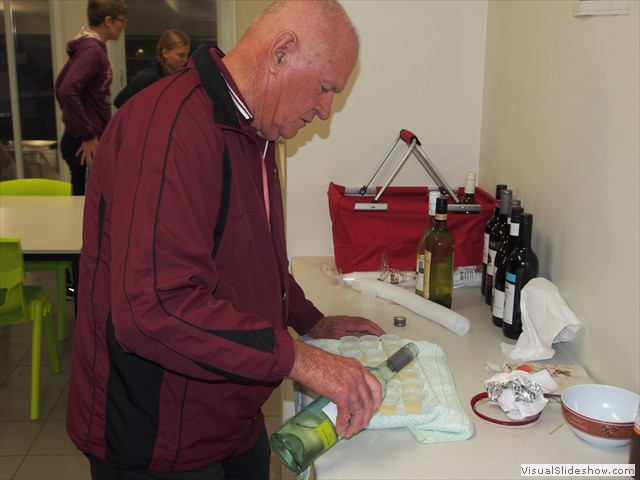 ...while Andrew pours over the wine...