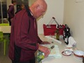 ...while Andrew pours over the wine...