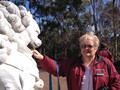 Monica feeding her hand to the sacred lion...