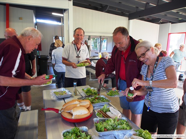 Dishing up Deborah & Robs sausage sizzle...